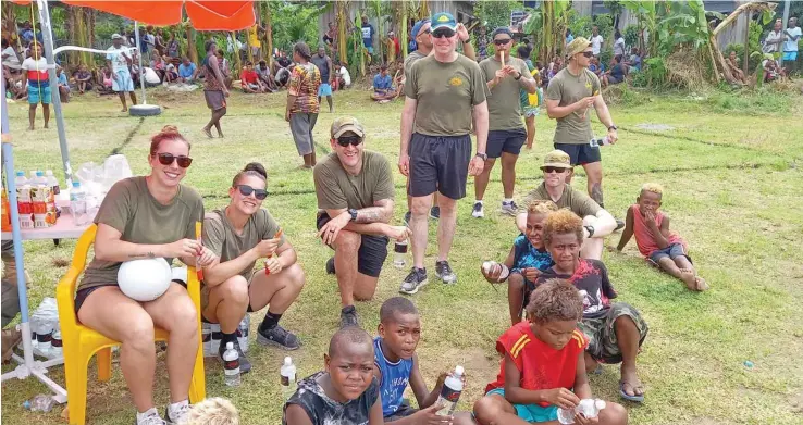  ?? ?? Australian Defence Force personnel amongst the children in Burns Creek, Solomon Islands enjoys a day of sports.