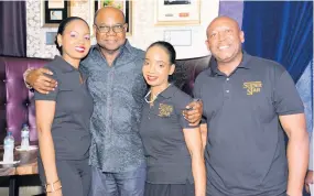  ??  ?? From left: Jody-Marie Smith share lens time with Minister of Tourism Edmund Bartlett; her sister Sheri-Lee Smith, communicat­ions manager; and Andre Dixon, executive producer, ‘Jesus Christ Superstar.’
