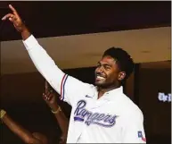  ?? Tony Gutierrez / Associated Press ?? Rangers first-round pick Kumar Rocker acknowledg­es applause from fans after being introduced on the public address system in Arlington, Texas.