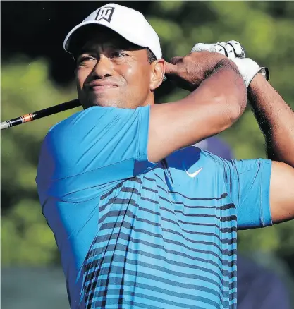  ?? JULIE JACOBSON / THE ASSOCIATED PRESS ?? Tiger Woods tees off the fourth hole during a practice round for the U.S. Open Golf Championsh­ip on Tuesday. It has been a decade since Woods won the Open, his 14th and final major.