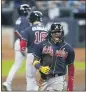  ?? ERIC GAY — THE ASSOCIATED PRESS ?? The Braves’ Ronald Acuna Jr. (13) celebrates after scoring during the third inning of Game 3of their NLDS against the Marlins on Thursday.