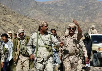  ?? EPA ?? Pro-government fighters yesterday after driving Houthi rebels from the district of Bayhan, 320 kilometres east of Sanaa, where they now control this oil-rich area of Shabwa province