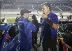  ?? JOHN RAOUX — THE ASSOCIATED PRESS ?? Reed Sorenson, left, talks with Michael Waltrip, a former driver and now TV commentato­r, on pit road before the first of two Daytona 500qualify­ing auto races at Daytona Internatio­nal Speedway, Thursday, Feb. 13, 2020, in Daytona Beach, Fla.