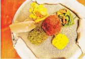  ?? ?? Muya Ethiopian Restaurant’s veggie meal with fresh injera is made in-house. The flatbread also serves as one’s utensil.