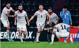  ?? ?? Afghanista­n's Sharif Mukhammad (second from left) celebrates with teammates after scoring the late winner against India in Guwahati on Tuesday. Photograph: Biju Boro/AFP/ Getty Images