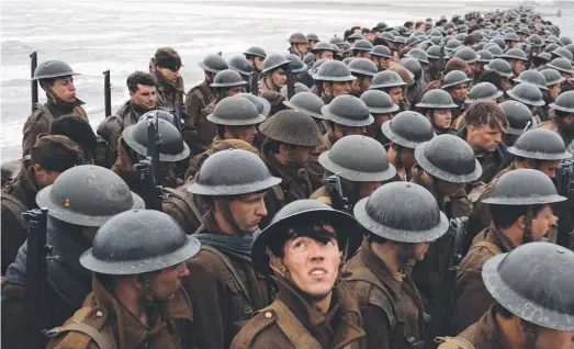  ??  ?? Soldiers gather in Dunkirk, an epic war movie like no other