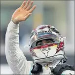  ??  ?? Lewis Hamilton celebrates his pole position in Abu Dhabi