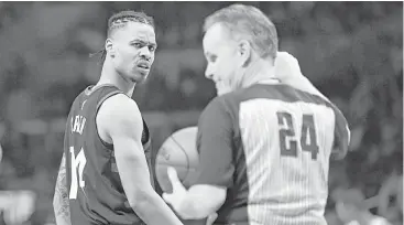  ?? Mark J. Terrill / Associated Press ?? The Rockets’ Gerald Green, left, wasn’t too pleased after being assessed a technical foul by referee Mike Callahan in Monday night’s loss at Staples Center.