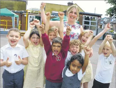  ?? Picture: Andy Jones FM4397244 ?? St Michael’s Church of England Infant School pupils with head teacher Lisa Dicker