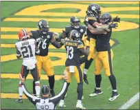  ?? TIM PHILLIS — FOR THE NEWS-HERALD ?? The Steelers celebrate a touchdown as Denzel Ward returns to the Browns’ sideline Oct. 18 in Pittsburgh.