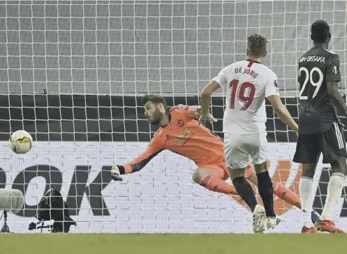  ??  ?? 0 Sevilla’s Luuk de Jong scores his side’s second goal to break Manchester United hearts in the Europa League semi-final in Cologne.