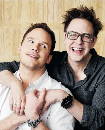  ?? CHRIS PIZZELLO/THE ASSOCIATED PRESS ?? Chris Pratt, left, star of Guardians of the Galaxy Vol. 2, is embraced by the film’s director, James Gunn, who jokes the studio insisted on a “beefcake clause.” The film opens Friday.