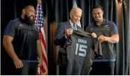  ?? PHOTO: FAIRFAX NZ ?? United States Vice-President Joe Biden is presented with a personalis­ed All Black rugby jersey by All Blacks Charlie Faumuina, left, and Jerome Kaino in Auckland yesterday.