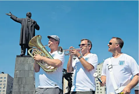  ??  ?? Steve Wood 54, John Hemmingham, 55, and Steve Homes, 47, of the England Band in Lenin Square, Nizhny Novgorod, ahead of the team’s second World Cup game, against Panama