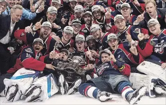  ?? CANADIAN PRESS FILE PHOTO ?? The Spitfires celebrate after defeating the Erie Otters to win the Memorial Cup in Windsor last May.
