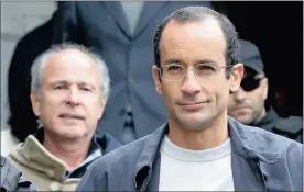  ?? PHOTO: REUTERS ?? Marcelo Odebrecht, right, the head of Odebrecht, and Otavio Marques Azevedo, chief executive of Andrade Gutierrez, are escorted by federal police officers on Friday.