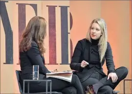  ?? Mike Windle Getty Images for Vanity Fair ?? ELIZABETH HOLMES, right, founder and chief executive of blood-testing firm Theranos Inc., with NBC News’ Maria Shriver at a Vanity Fair event in October.