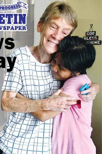  ??  ?? TEMPORARY REPRIEVE – Sister Patricia Fox is hugged by an admirer at her home in Quezon City Monday after she learned that the Department of Justice had granted her petition to review the Immigratio­n bureau’s order to nullify her missionary visa. (Mark...