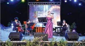  ?? ?? The Manila Philharmon­ic Orchestra Quartet enchants the crowd with a soothing serenade, setting the perfect festive tone for the lighting of Villar City’s Heritage Tree.