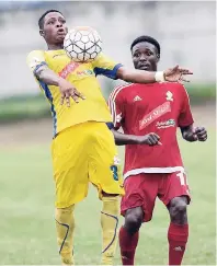  ??  ?? Harbour View’s Le-Shaun Young (left) controls the ball under close attention from University of the West Indies’ Kemar Flemmings during their Red Stripe Premier League game at UWI yesterday. The match ended 1-1.