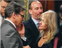  ?? Andrew Harnik / Associated Press ?? Presidenti­al counselor Kellyanne Conway greets incoming Energy Secretary Rick Perry on Thursday before Vice President Mike Pence swore in the former Texas governor.