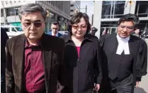  ??  ?? Baratov’s parents, Akhmet and Dinara, arrive at their son’s Toronto court appearance in July 2017 with one of his lawyers, Deepak Paradkar