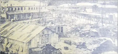  ?? Picture: FILE ?? The scene from Nabukalou Creek, looking towards Cumming St and Waimanu Rd, the morning after the fire on February 10, 1923.