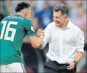  ?? AP ?? Mexico's Hector Herrera celebrates with coach Juan Carlos Osorio after the upset win over holders Germany on Sunday.
