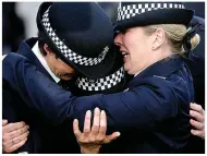  ??  ?? Officers grieve at the funeral of the PC who was killed by robbery gang members, from left, Yusuf Jama, Muzzaker Shah and Mustaf Jama