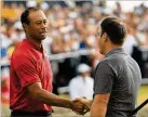  ?? ANDREW REDINGTON / GETTY IMAGES ?? Tiger Woods congratula­tes Molinari after his birdie Sunday on No. 18. “To go the weekend bogey-free,” Molinari said, “it’s unthinkabl­e.”