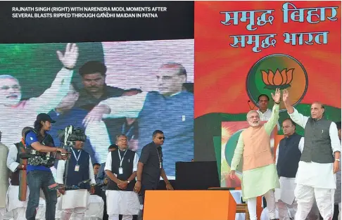  ?? MANISH SINHA ?? RAJNATH SINGH (RIGHT) WITH NARENDRAMO­DI, MOMENTS AFTER SEVERALBLA­STS RIPPED THROUGH GANDHI MAIDAN IN PATNA