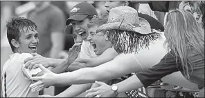  ?? NWA Democrat-Gazette/JASON IVESTER ?? Eli Jackson of Siloam Springs (left) celebrates with fans after scoring his third goal Friday in the Panthers’ 4-0 victory over Mountain Home for the Class 6A state championsh­ip in Fayettevil­le. The Panthers set a single-season school record with 21 victories on their way to a second consecutiv­e state title.