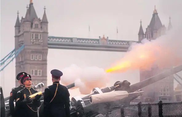  ?? ?? TRIBUTE: The Honourable Artillery Company fires a 62-gun royal salute at Tower Wharf, London, to mark the 74th birthday of King Charles III.