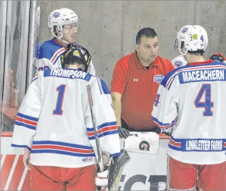  ?? JASON SIMMONDS/JOURNAL PIONEER ?? Summerside Western Capitals head trainer and equipment manager John Blanchard talks to defenceman Conor MacEachern, goaltender Daniel Thompson and back-up goaltender Dominik Tmej during a media timeout of a recent MHL (Maritime Junior Hockey League) game at Eastlink Arena.