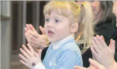  ?? GORD WALDNER/FILES ?? Maddie Smith and others applaud a large donation to The Children’s Discovery Museum’s in February.