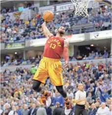  ?? GETTY IMAGES ?? Paul George eyes the rim before scoring two of his 23 points on Thursday.