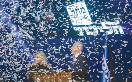  ?? (Marc Israel Sellem/The Jerusalem Post) ?? PRIME MINISTER Benjamin Netanyahu and his wife, Sara, celebrate his apparent win at a post-election rally in Tel Aviv.