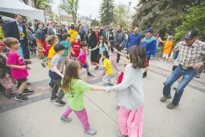  ?? LIAM RICHARDS ?? People dance during a reconcilia­tion flag-raising Friday in Saskatoon. The annual event recognizes the history of residentia­l schools.