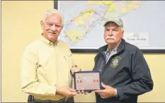  ?? KIRK STARRATT ?? West Nova Scotia Regiment Regimental Associatio­n president Ron Stonier and director Garry Randall with one of the plaques given to delegates who attended a twinning ceremony for the Town of Kentville and Castel di Sangro, Italy, that was held in the Italian city in 2017.