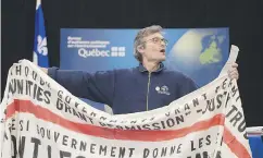  ?? JACQUES BOISSINOT / THE CANADIAN PRESS ?? Protester Jean Leger at an Energy East pipeline hearing.