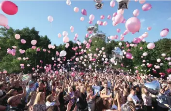  ?? — AFP ?? Well-wishers release thousands of balloons into the sky during a vigil to commemorat­e the victims of the May 22 attack on Manchester Arena at Tandle Hill Country Park in Royton, northwest England.