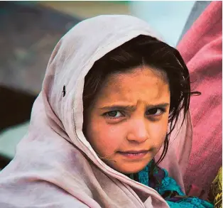  ?? Gulf News Archives ?? Hope in the face of despair
A girl displaced by the 2012 floods in Pakistan. The UAE has funded two bridges, 52 schools and 7 hospitals, as well as 64 water supply schemes in Swat.