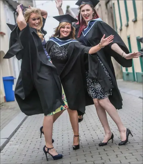  ??  ?? Delighted graduates Ellie Byrne, Foulksmill­s; Michelle Harding, Curracloe; and Birute Malinauska­ite from Laois.