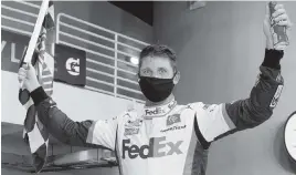  ?? CHRIS GRAYTHEN TNS ?? Denny Hamlin, driver of the No. 11 Toyota, celebrates in Victory Lane after winning the NASCAR Cup Series Dixie Vodka 400 at Homestead-Miami Speedway on June 14, 2020.