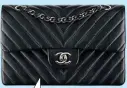  ??  ?? This is a Chanel 11.12, not a 2.55. Karl Lagerfeld created the former from the latter in 1983, the year he joined the fashion house. This season, it comes in herringbon­e calfskin at $6,310.