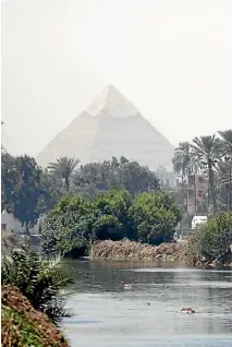  ?? PHOTO: REUTERS ?? The Pyramid of Khufu, the largest of the pyramids of Giza, has long been the subject of mystery and controvers­y.