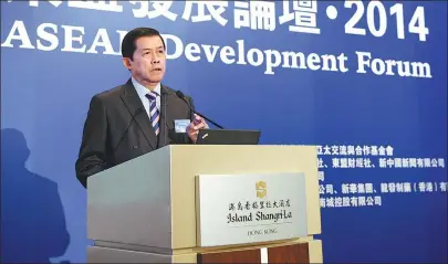  ?? QIN QING / XINHUA ?? Dabbaransi delivers a speech at the first ASEAN Developmen­t Forum in Hong Kong on Dec 13, 2014.