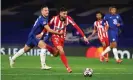  ??  ?? César Azpilicuet­a puts his arm across Yannick Carrasco after playing a short backpass, but no penalty was awarded. Photograph: Matthew Lewis/Uefa/Getty Images