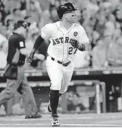  ?? [AP PHOTO] ?? Houston Astros’ Jose Altuve watches his home run clear the fence during the first inning in Game 1 of baseball’s American League Division Series against the Boston Red Sox on Thursday in Houston, Texas.