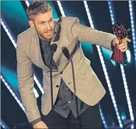  ?? AP PHOTO ?? Calvin Harris is seen accepting the award for dance artist of the year during the iHeartRadi­o Music Awards at The Forum on in Inglewood, Calif., in April 2016.